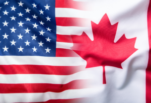 U.S. and Canadian flags side by side, representing a comparison of tax-loss harvesting rules between the two countries