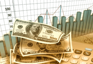 Dollar bills, charts, and a calculator illustrating financial strategy in the context of Long/Short Direct Indexing